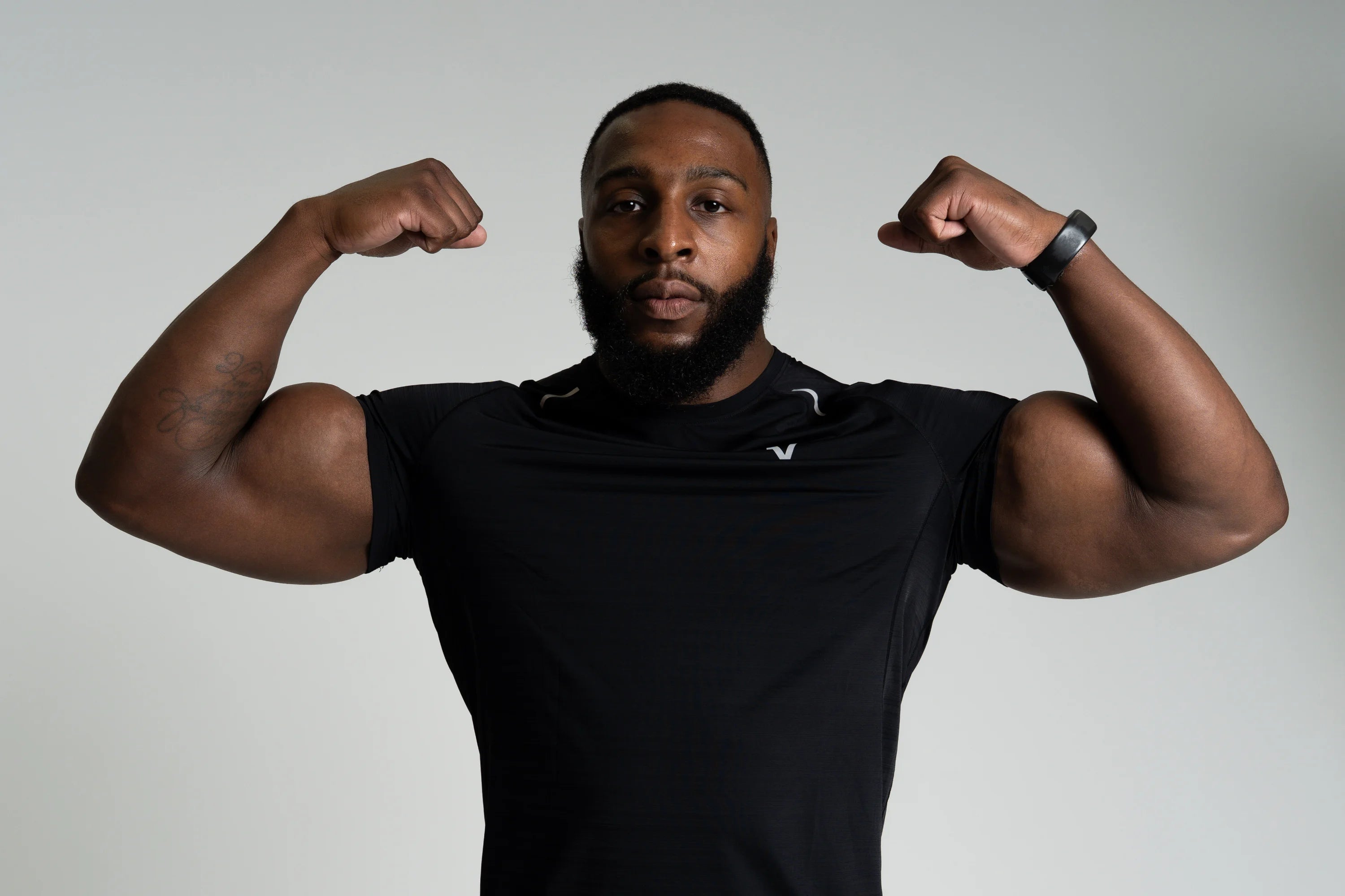 Man wearing Veritone men's performance activewear.