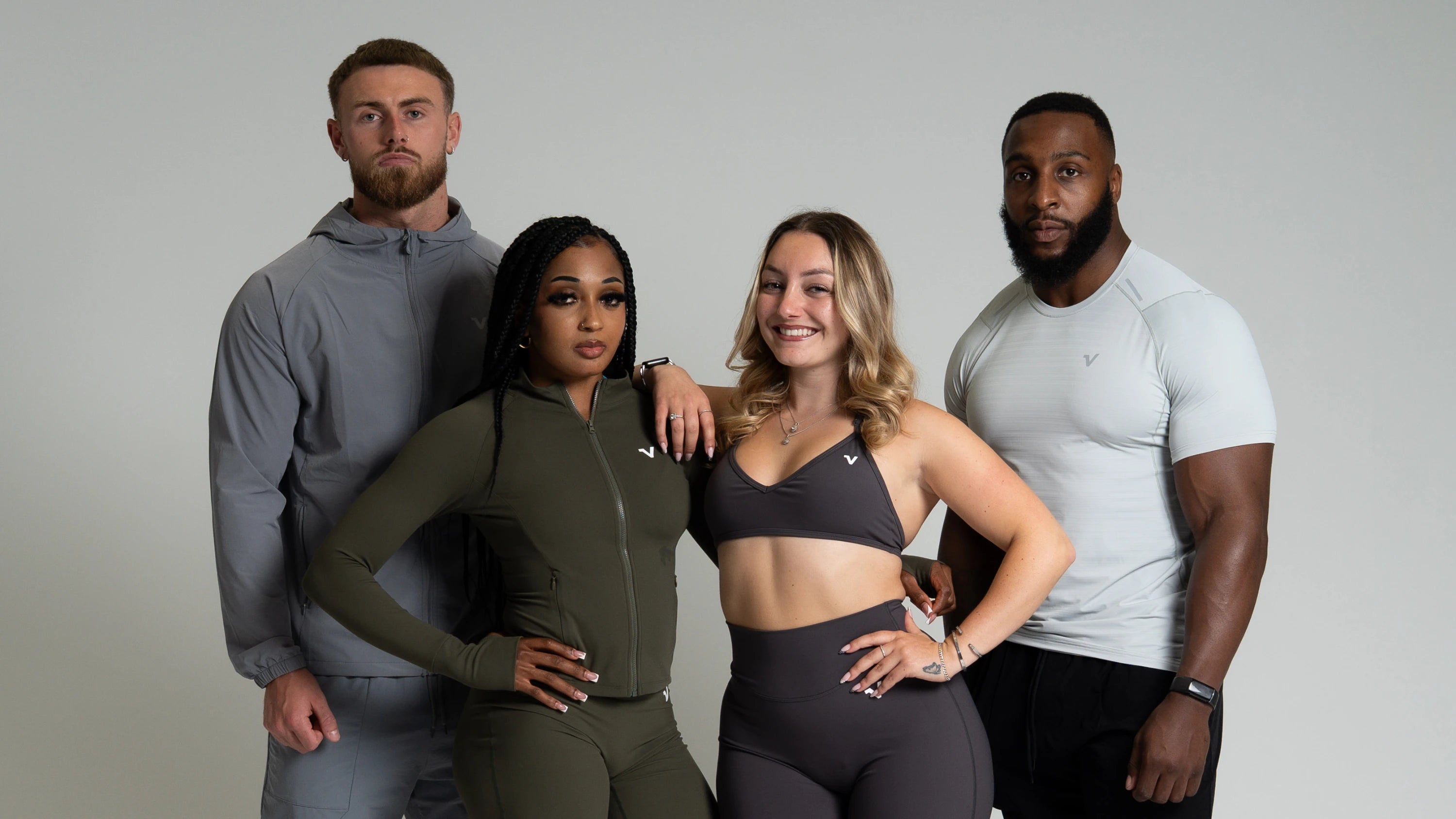Four models showcasing Veritone men's and women's activewear to promote the Veritone Toners Club.