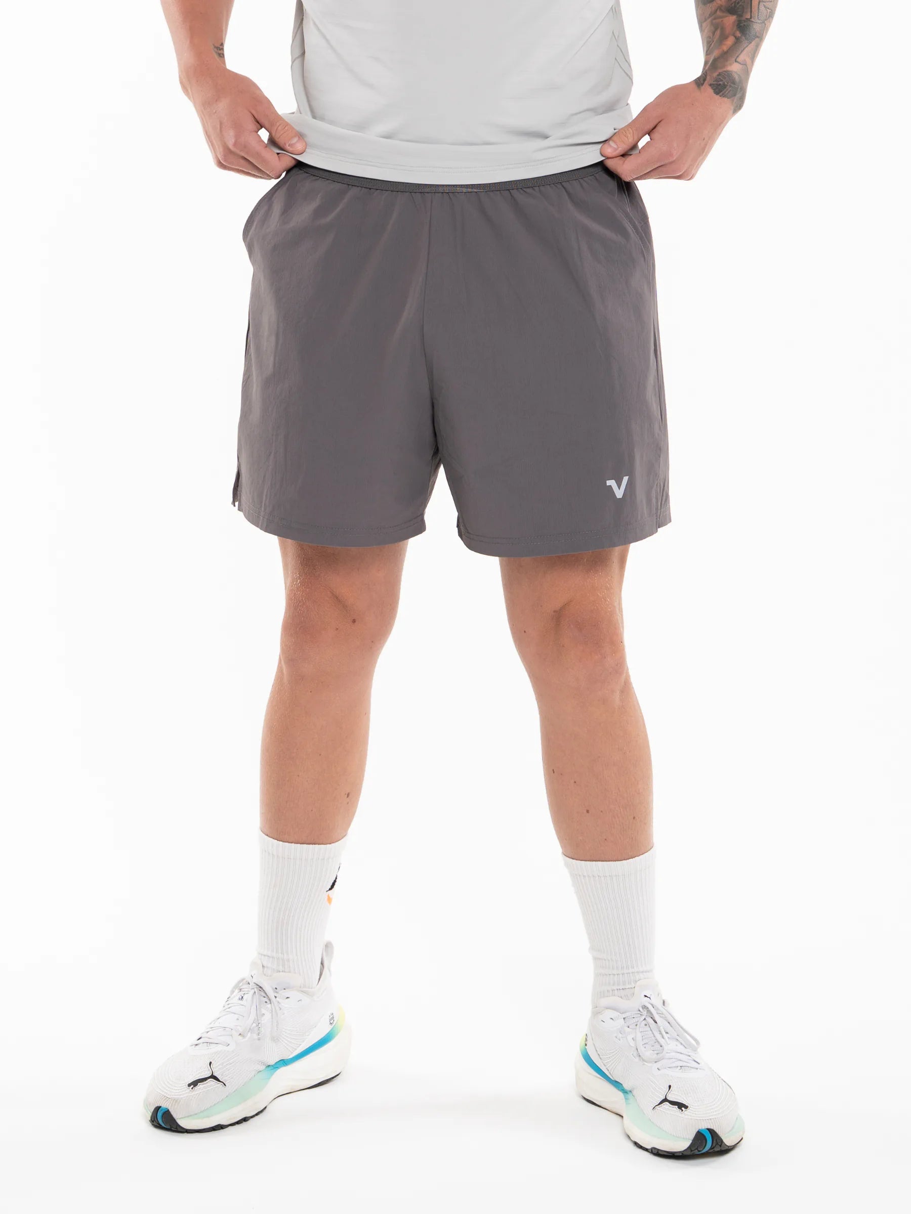Veritone Essential Training Shorts, Ash Grey – dark gray athletic shorts shown from the waist down against a white studio background.