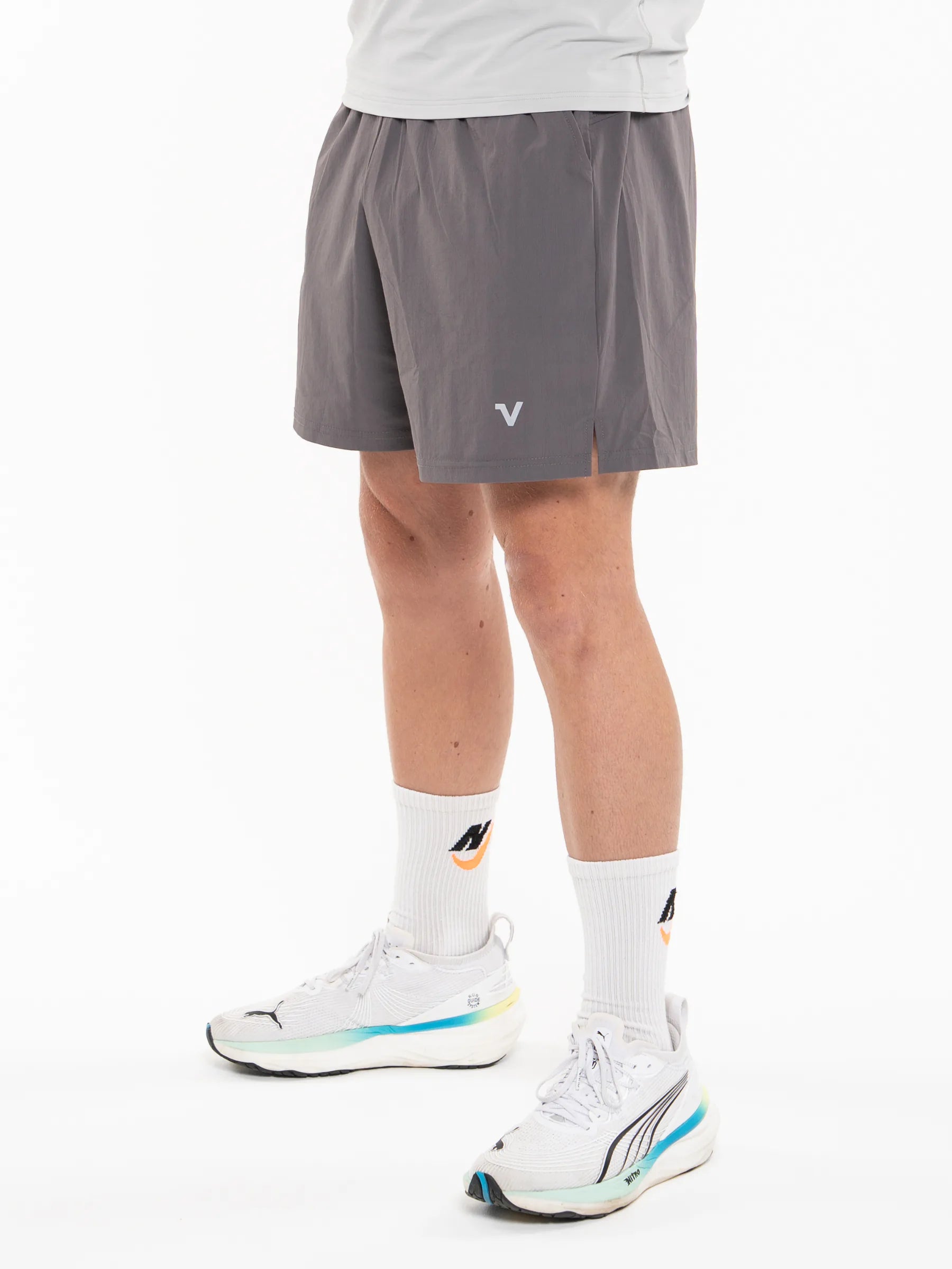 Veritone Essential Training Shorts, Ash Grey – dark gray athletic shorts shown from the waist down against a white studio background.