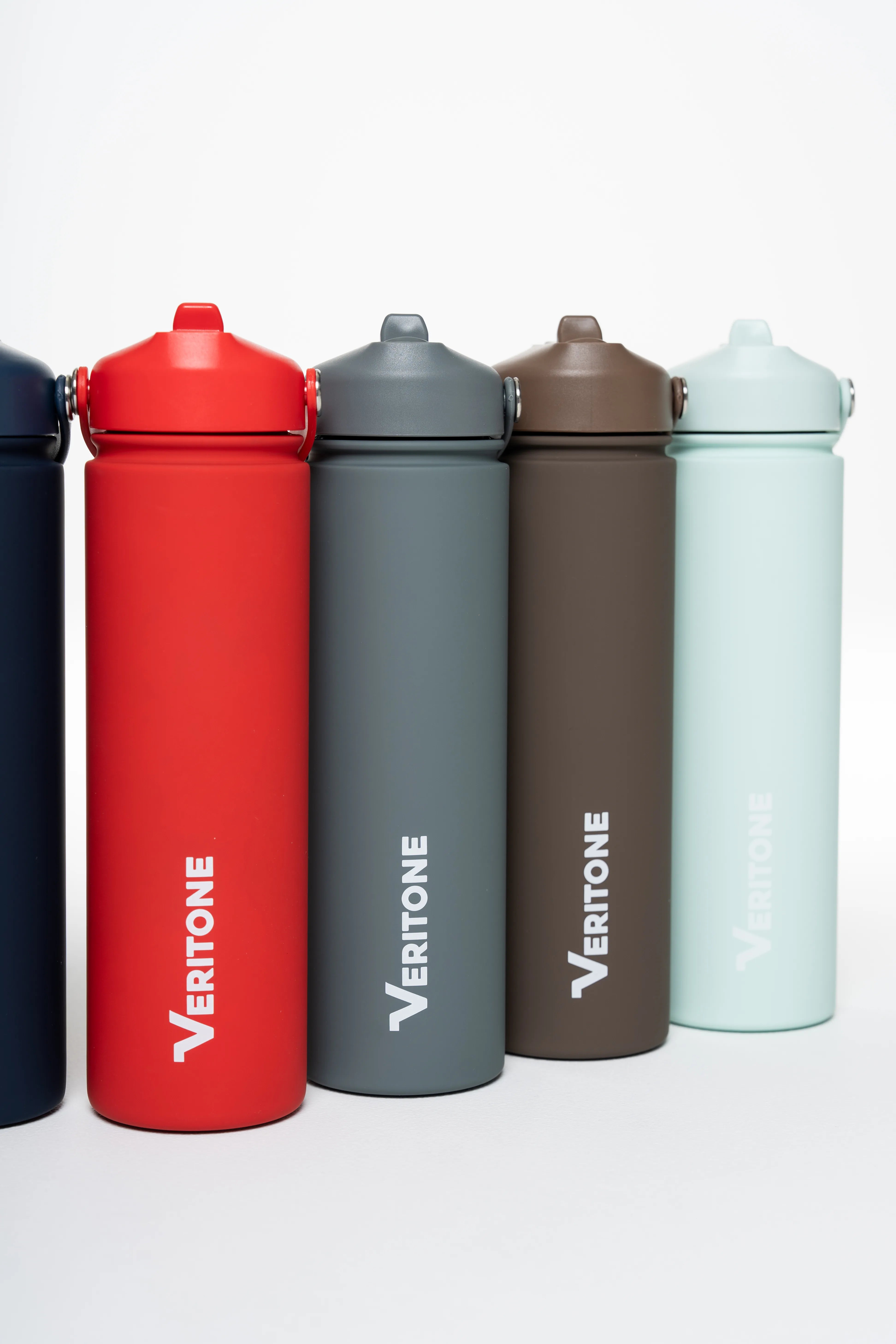 Five colorful water bottles with 'Vertitone' branding on a white background