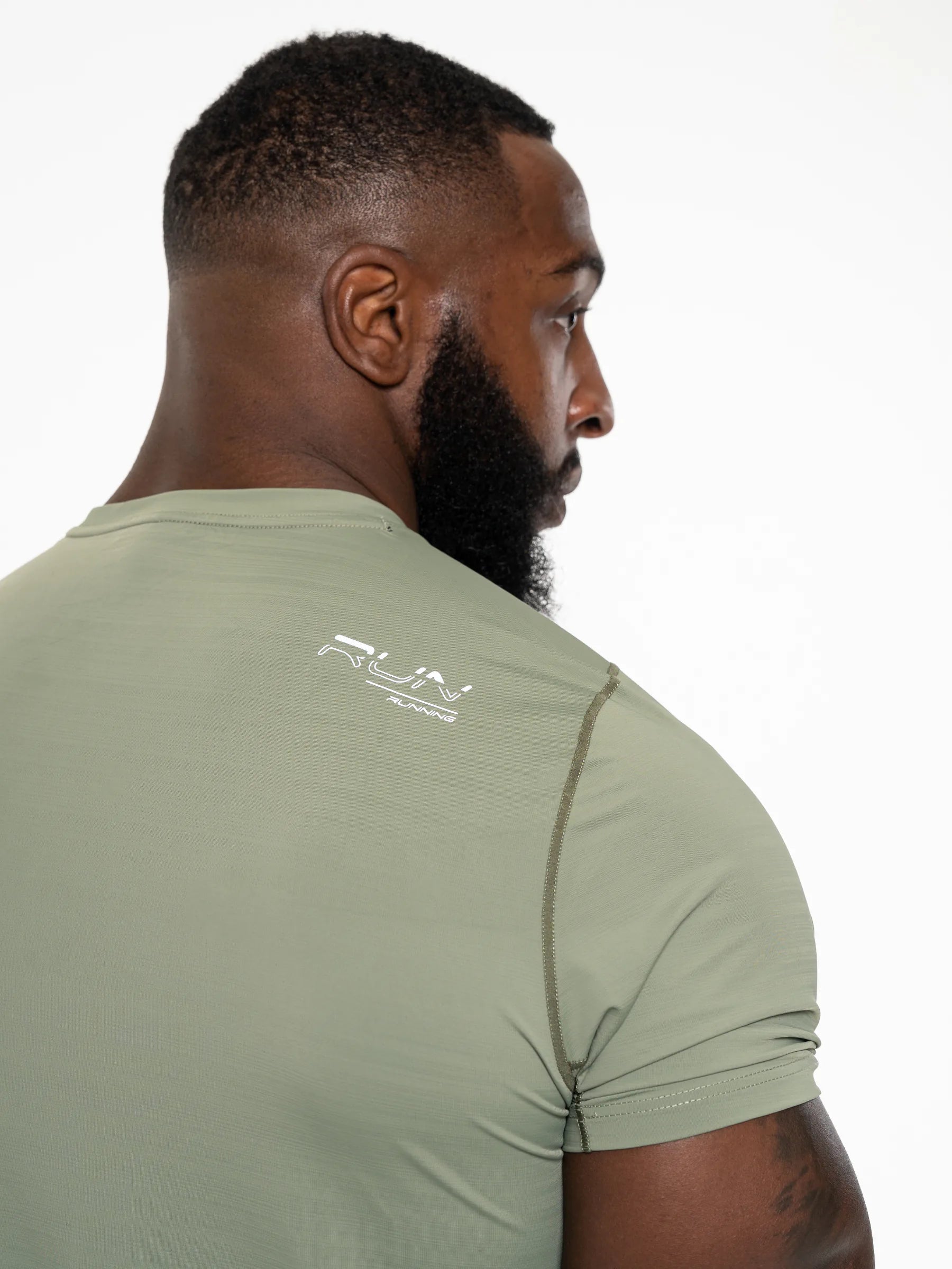 Veritone Prime Muscle Fit T-Shirt, Stone Khaki – a back view of a man wearing a green t-shirt with a RUN logo on a white background.