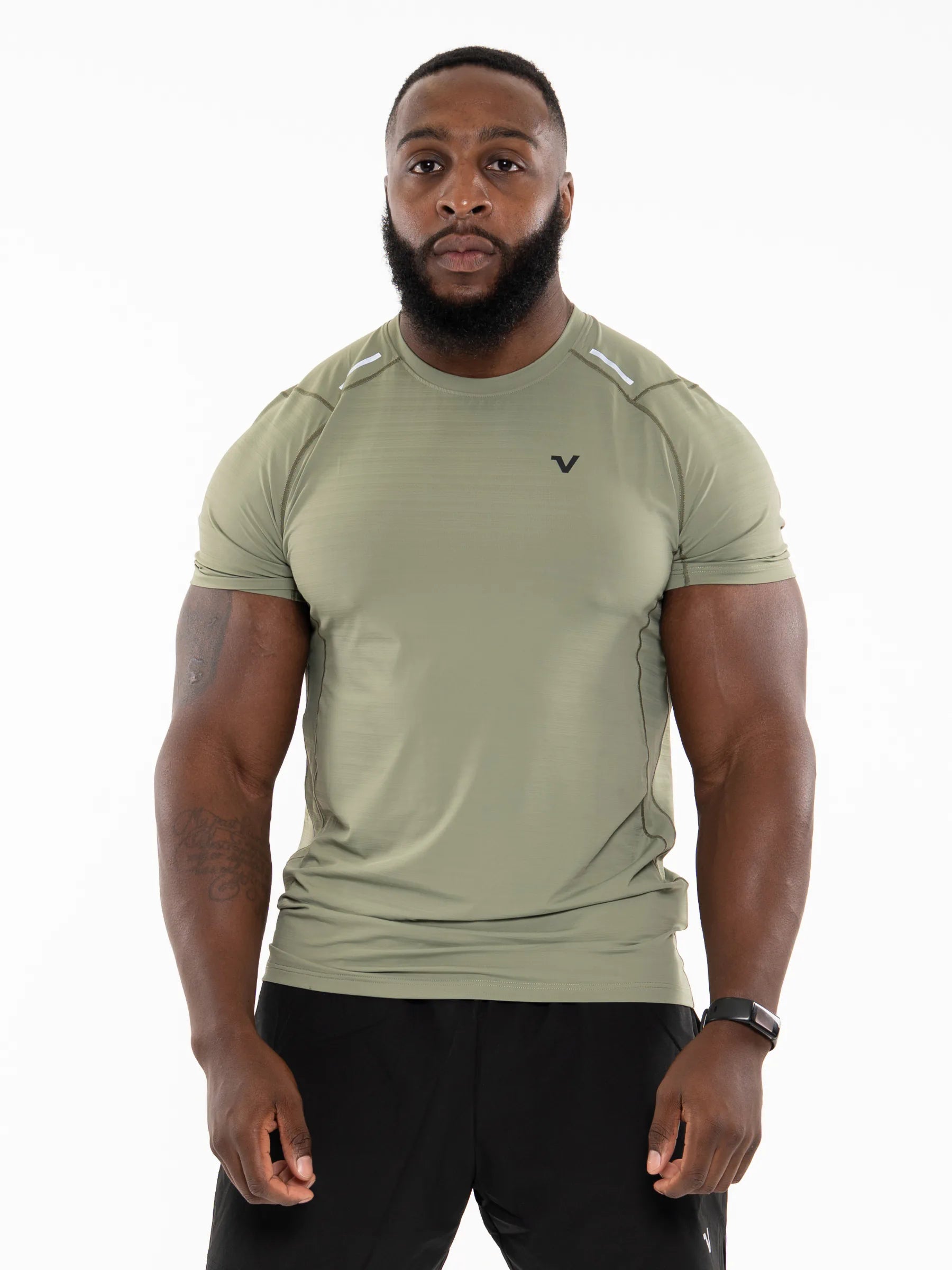 Veritone Prime Muscle Fit T-Shirt, Stone Khaki – Man wearing a green athletic shirt on a white background